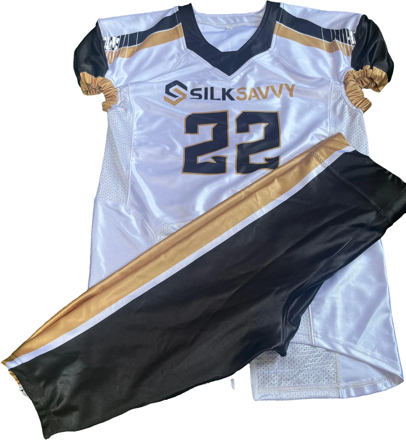 White American football jersey in navy and gold with the Silksavvy logo and number 22, laid flat with matching pants