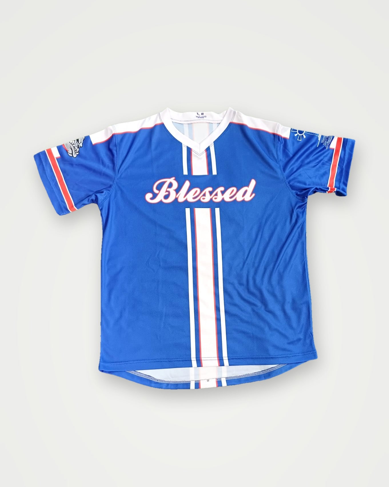 Blue sublimated baseball jersey with white stripes and script chest lettering