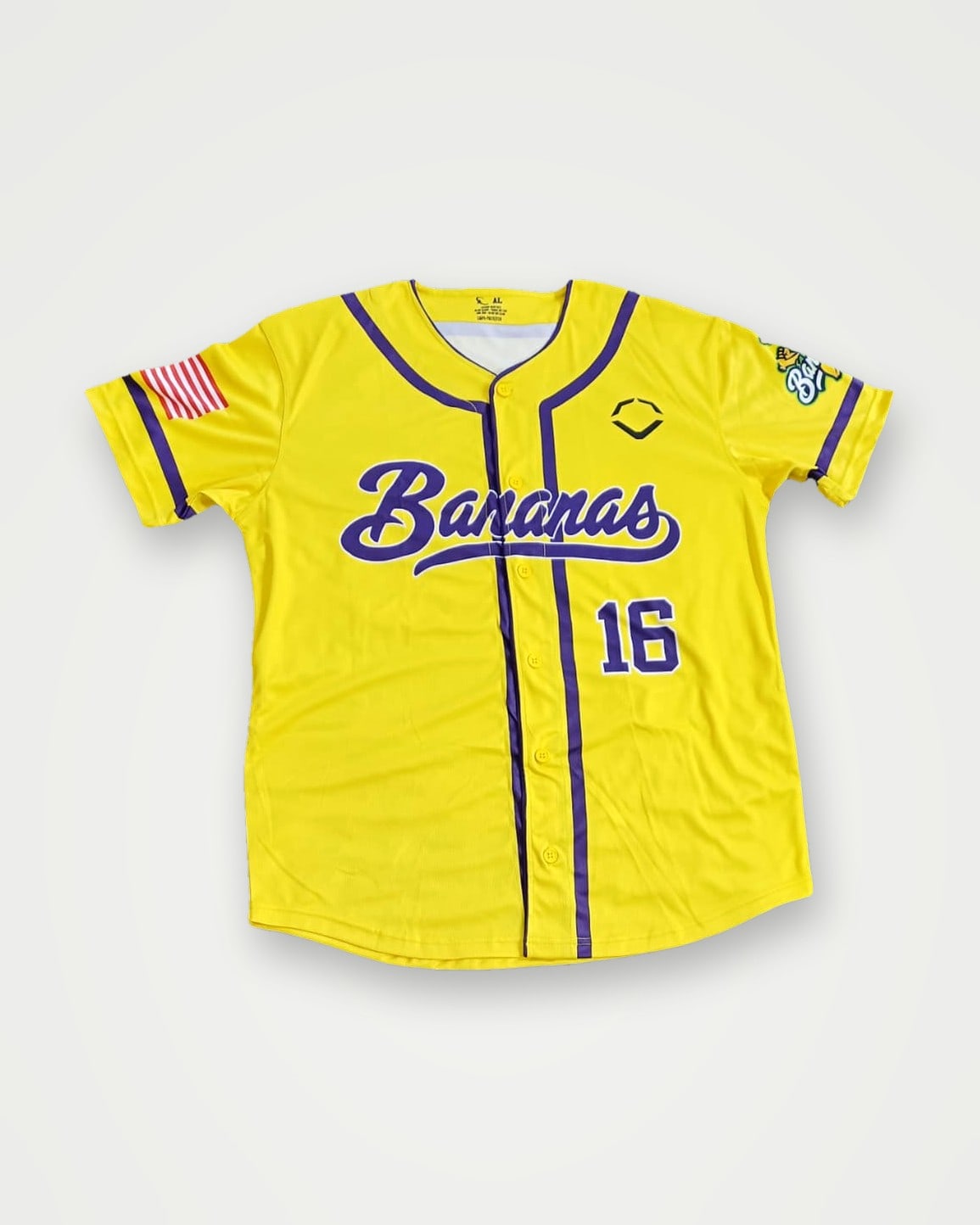 Yellow baseball jersey with purple script and number 16
