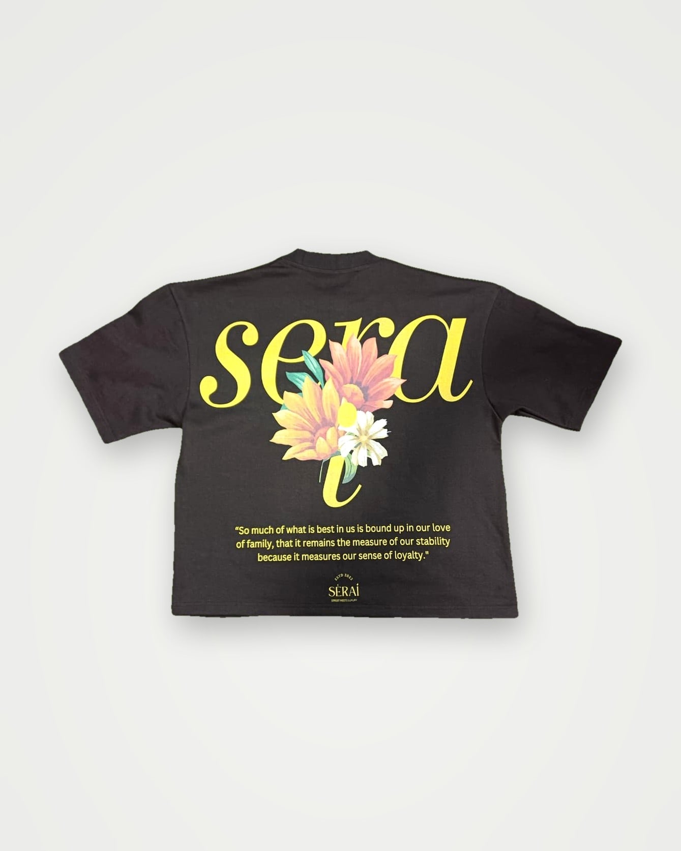 Charcoal boxy t-shirt with a yellow script and floral back print