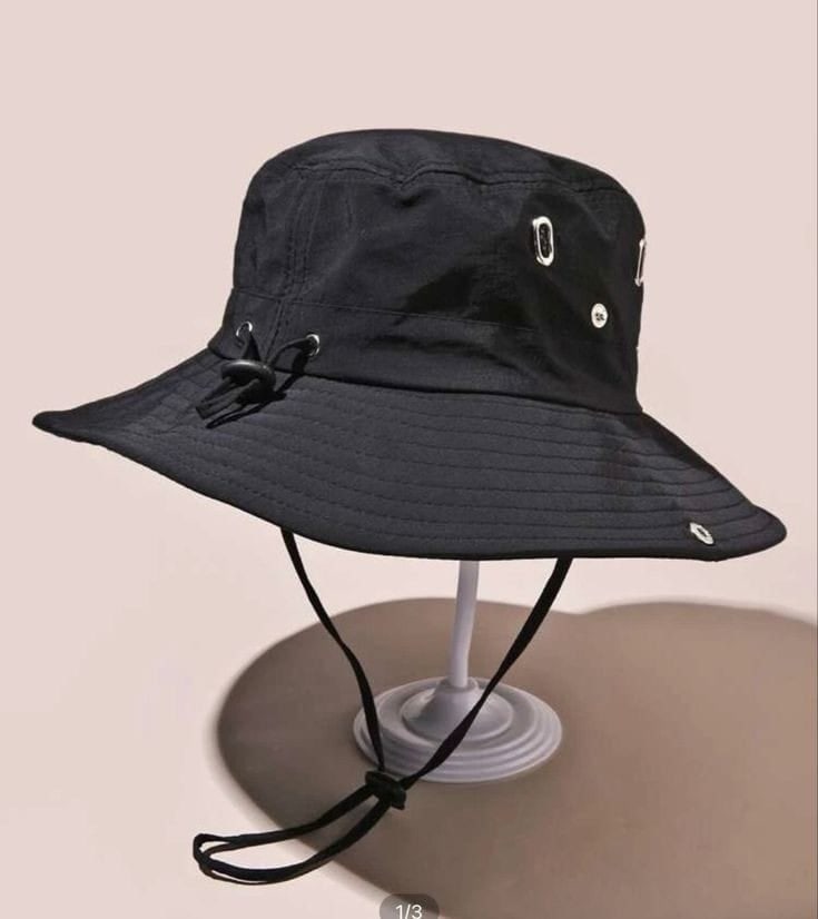 Black bucket hat with metal eyelets