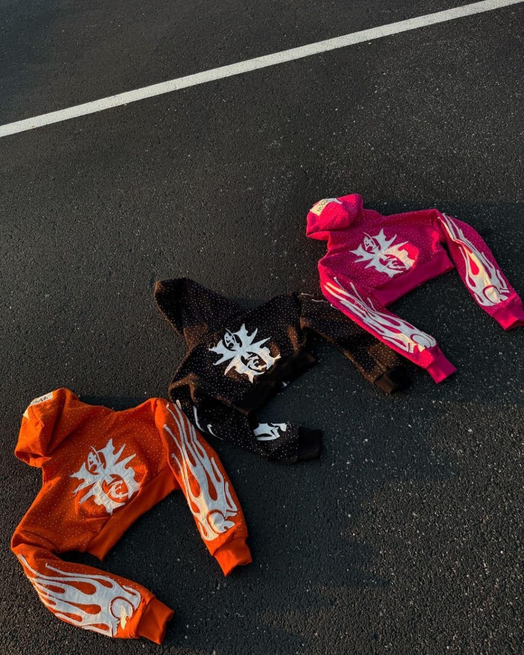 Cropped hoodies with flame sleeve graphics in several colourways