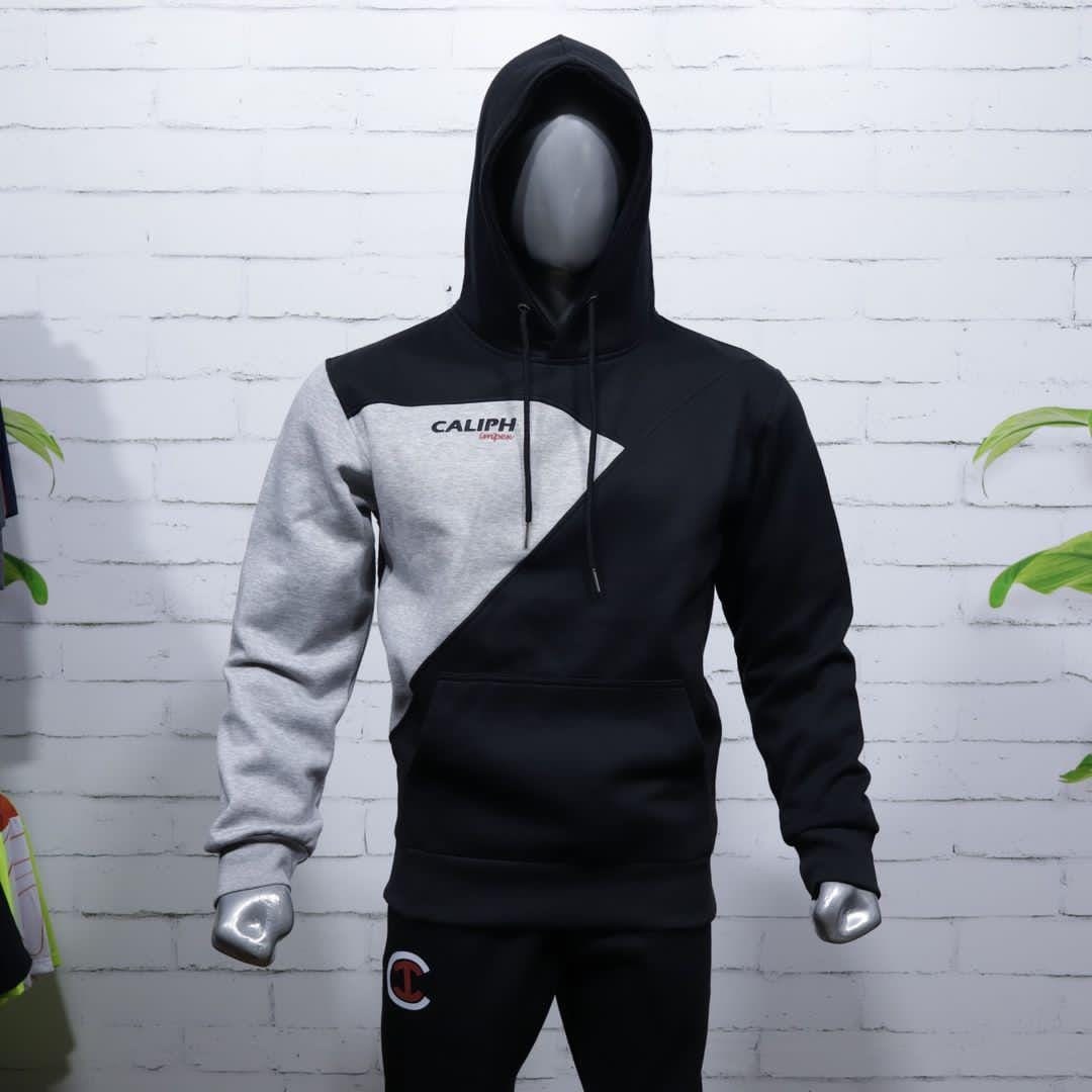 Grey and black colour-block hoodie on a mannequin