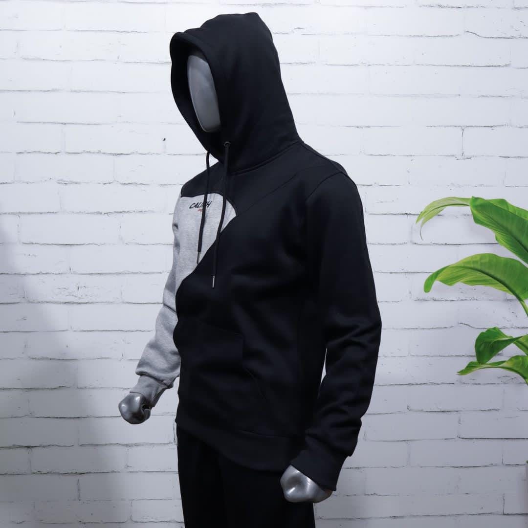 Side view of a grey and black colour-block hoodie