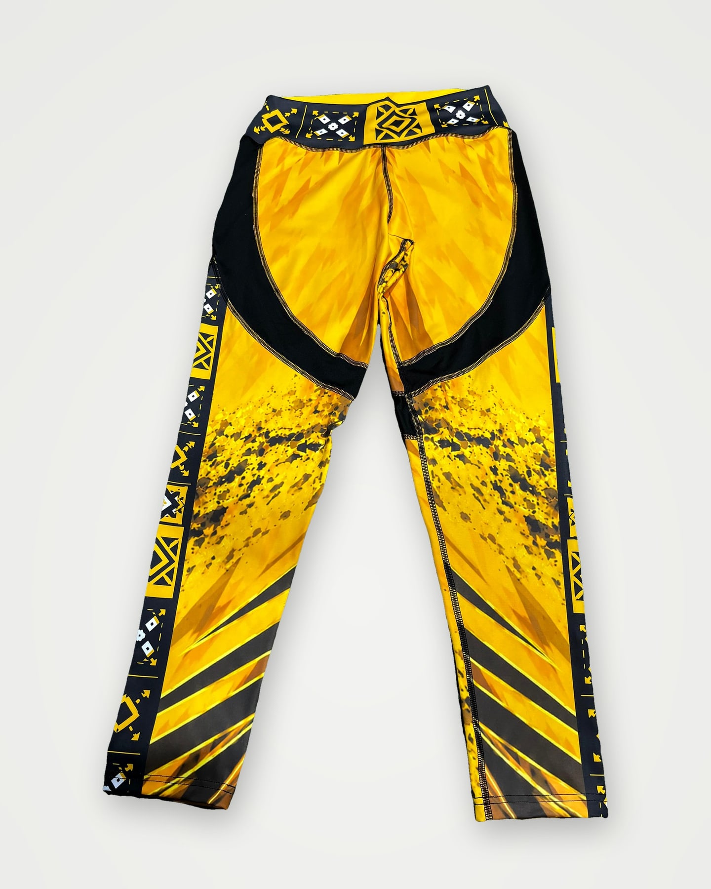 Gold and black sublimated leggings, back view
