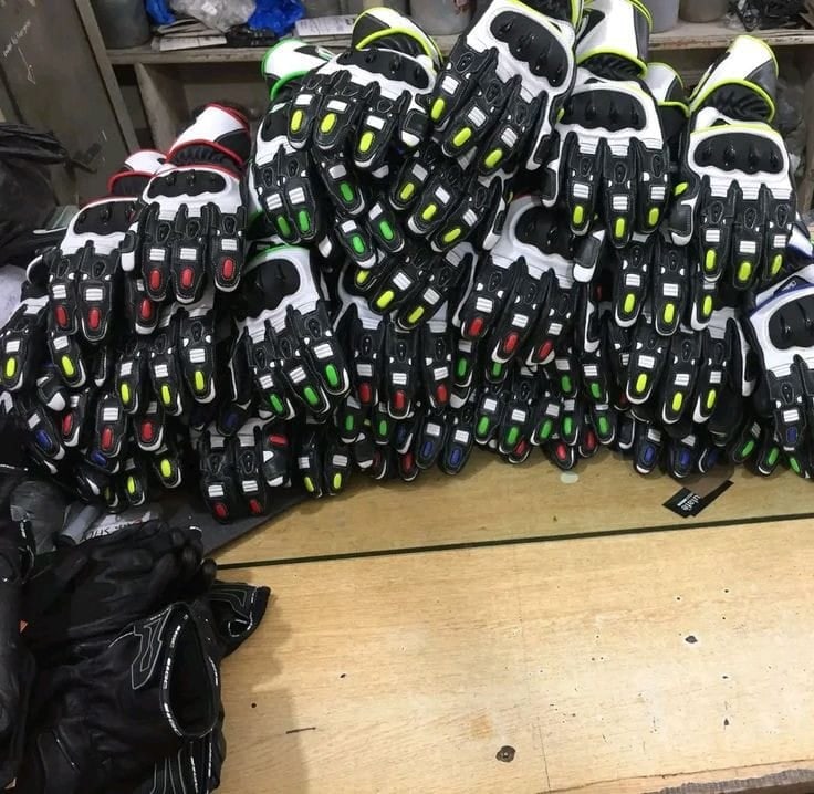 A batch of leather motorbike racing gloves in production