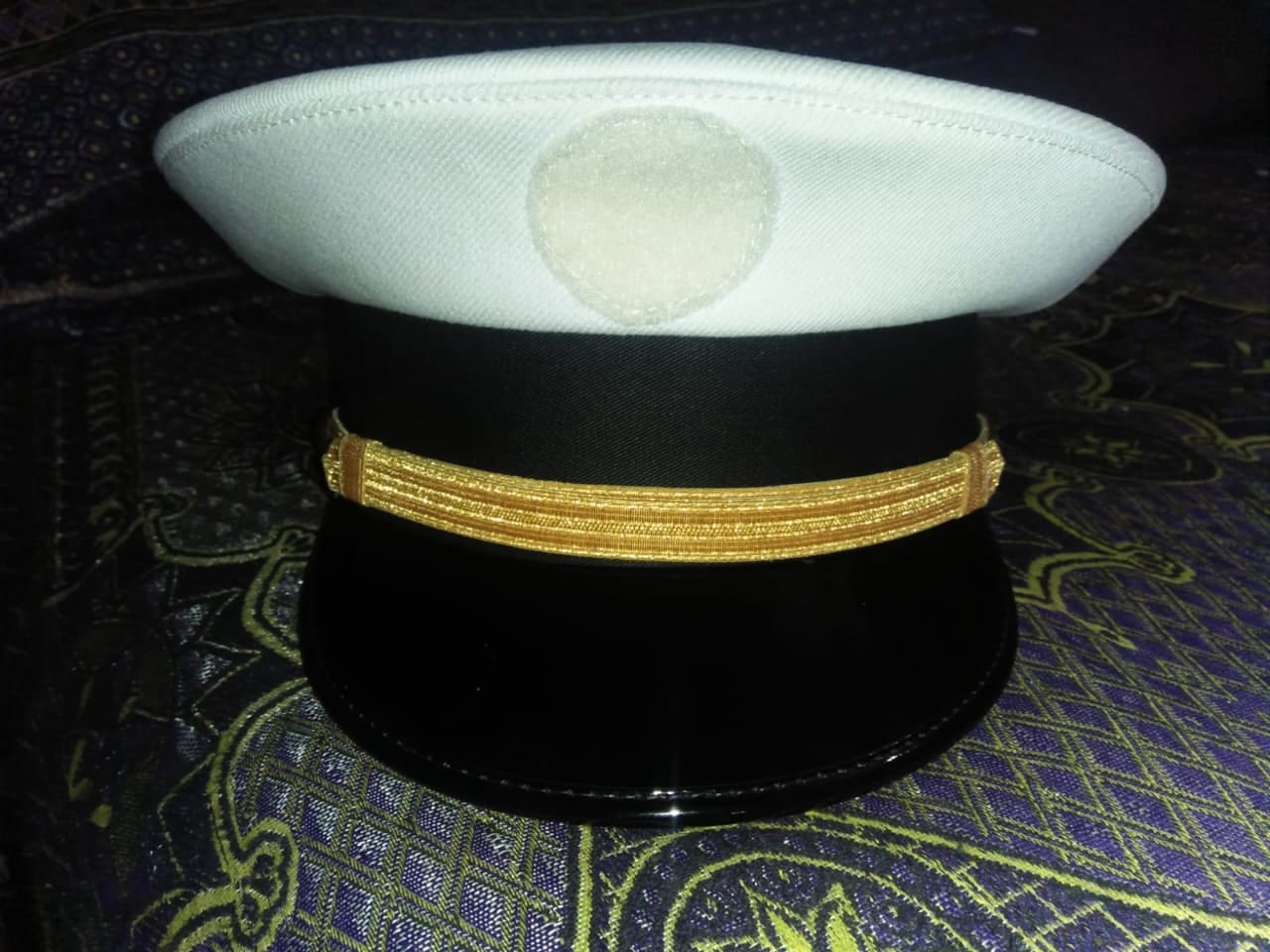 White-top peak cap with a gold band