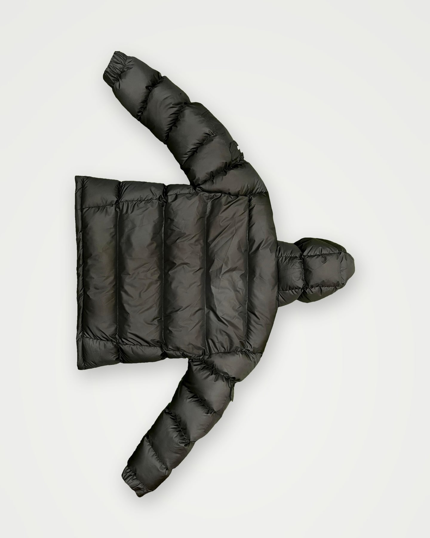 Black quilted hooded puffer jacket, back