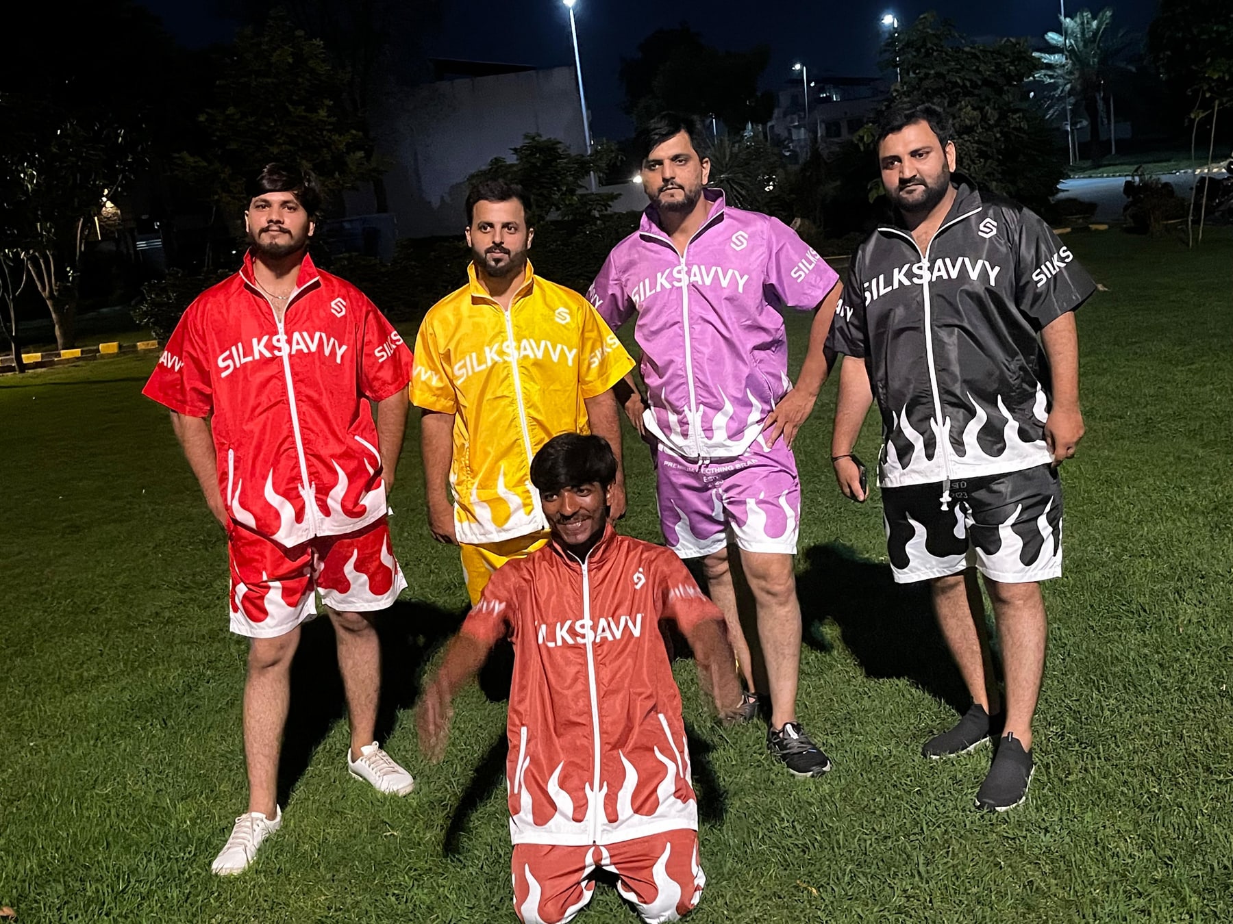 Team wearing Silksavvy flame-print shirts and shorts
