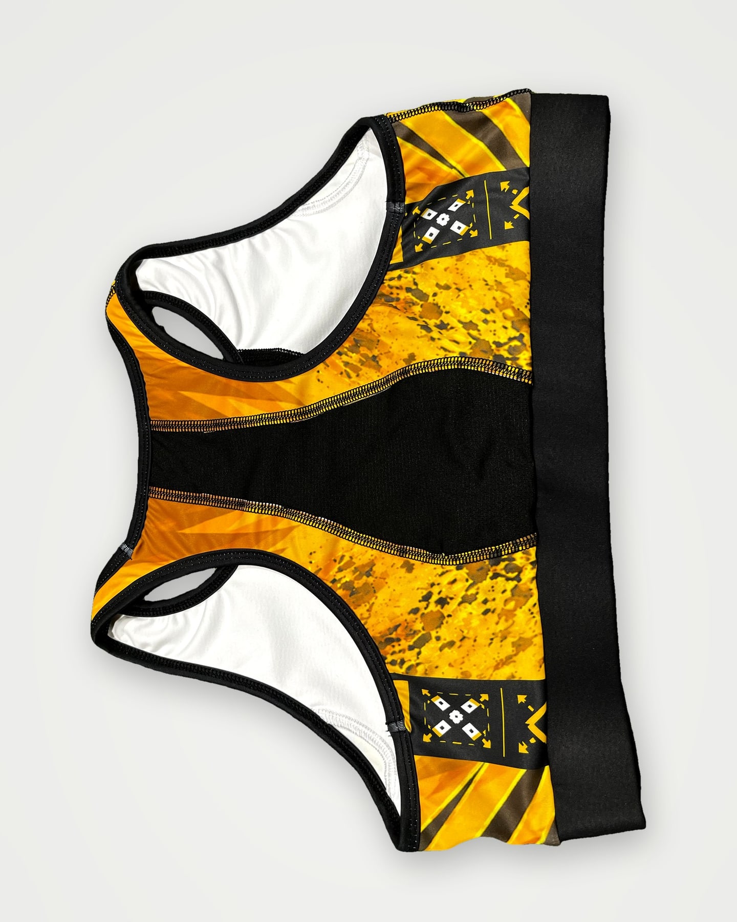 Gold and black sublimated sports bra, back view