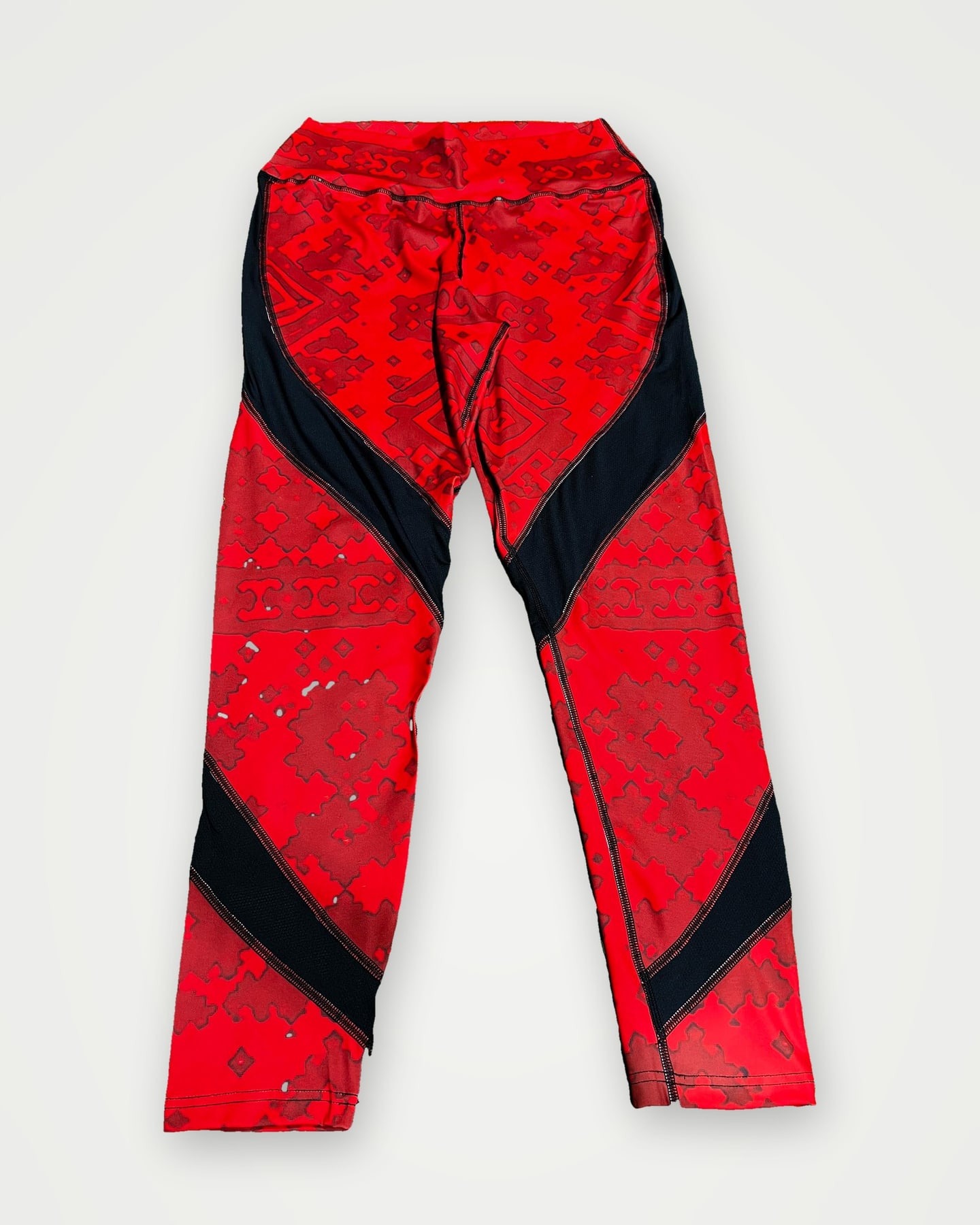 Red patterned leggings with black contrast panels