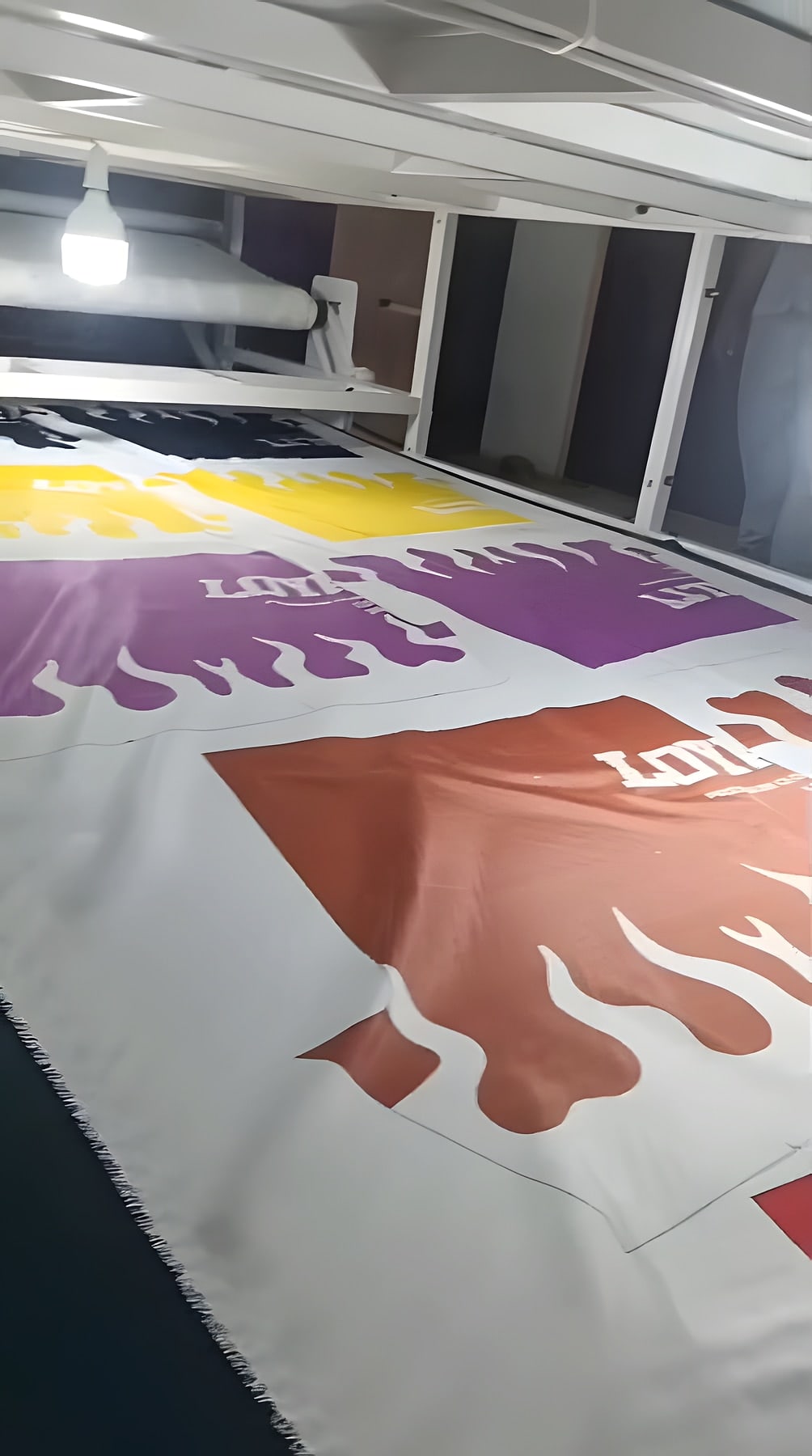 Printed garment panels on a roll of sublimated fabric