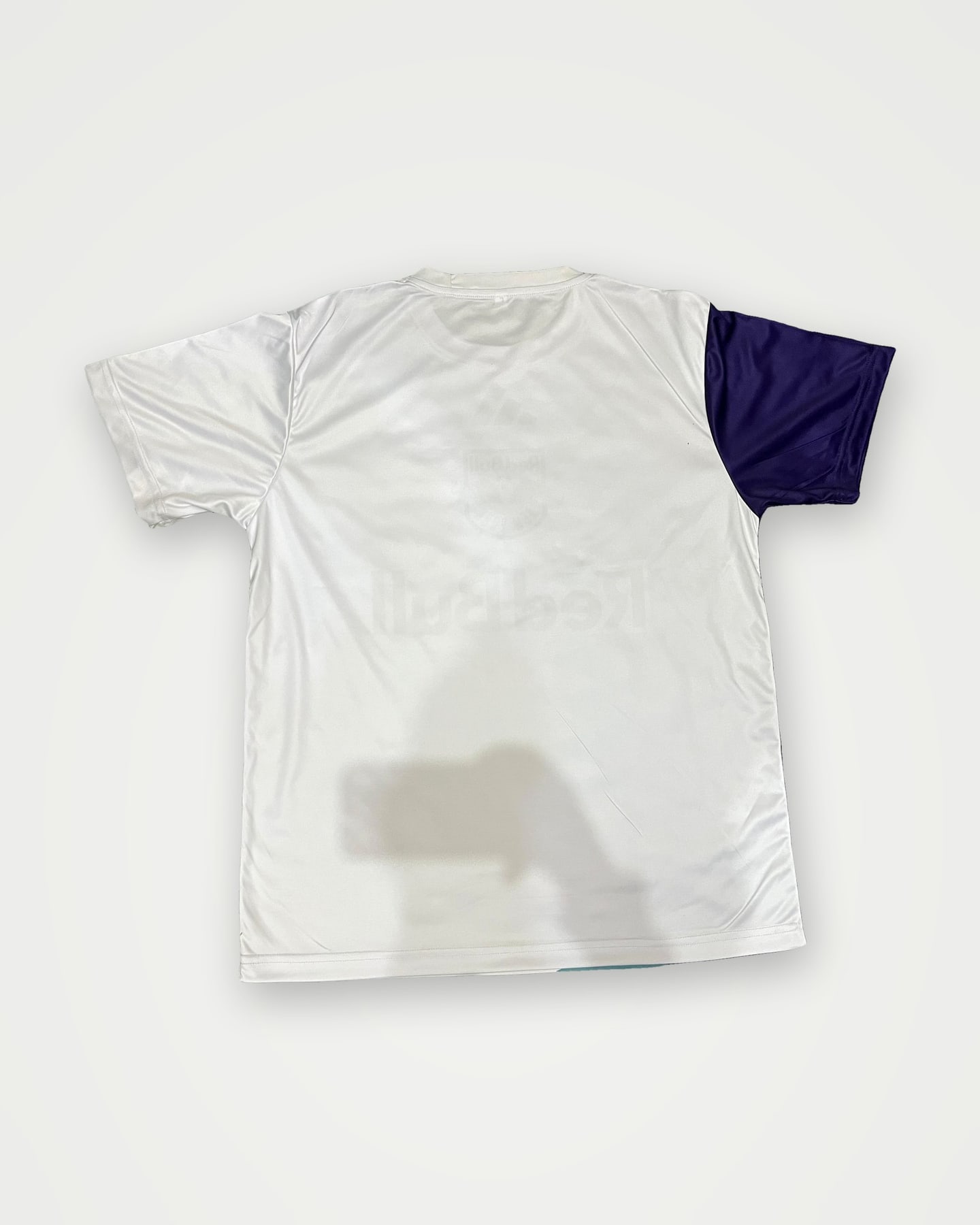 White performance tee with purple raglan sleeves
