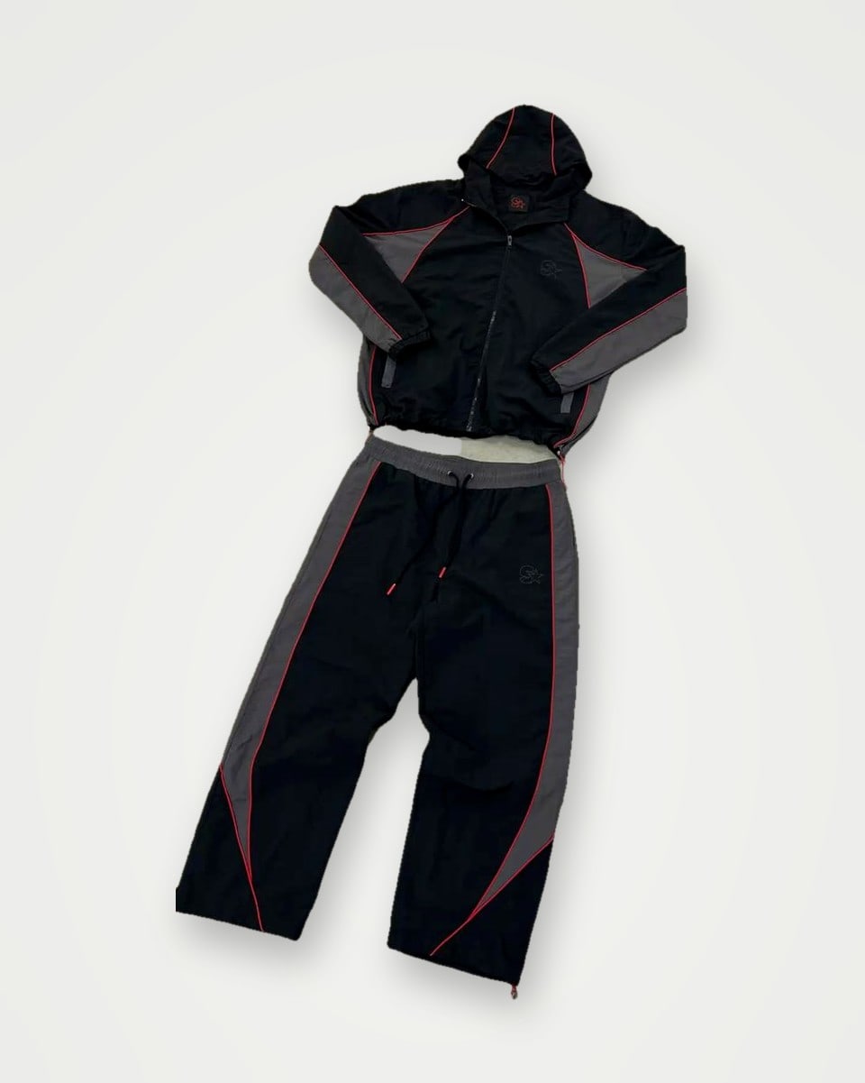 Black track jacket and trousers with grey panels and burgundy piping
