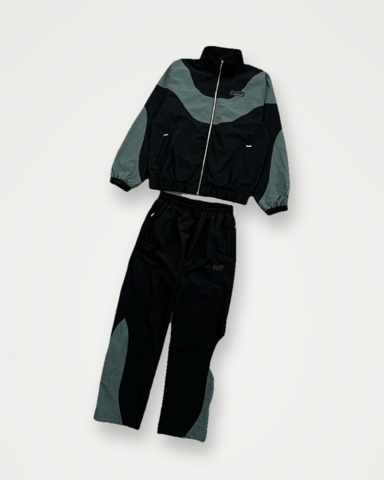 Black and grey-green shell track jacket with panelled trousers