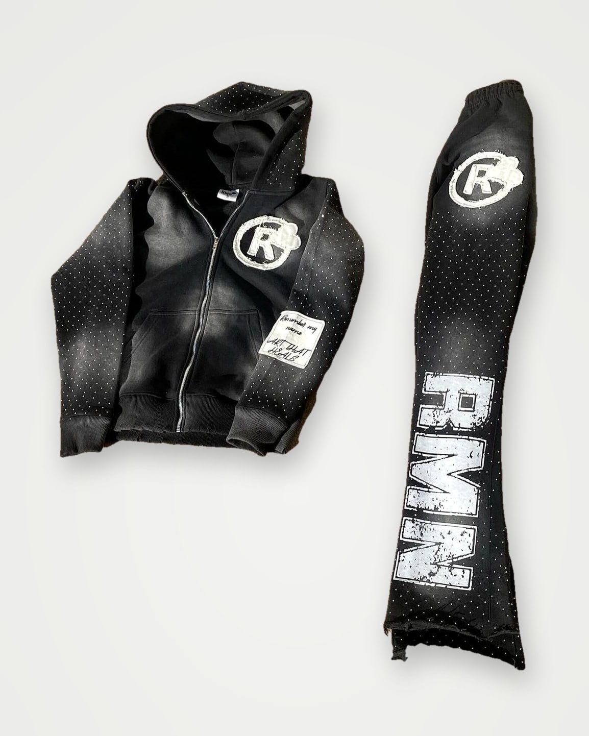 Black zip hoodie and flared sweatpants set with rhinestone graphics