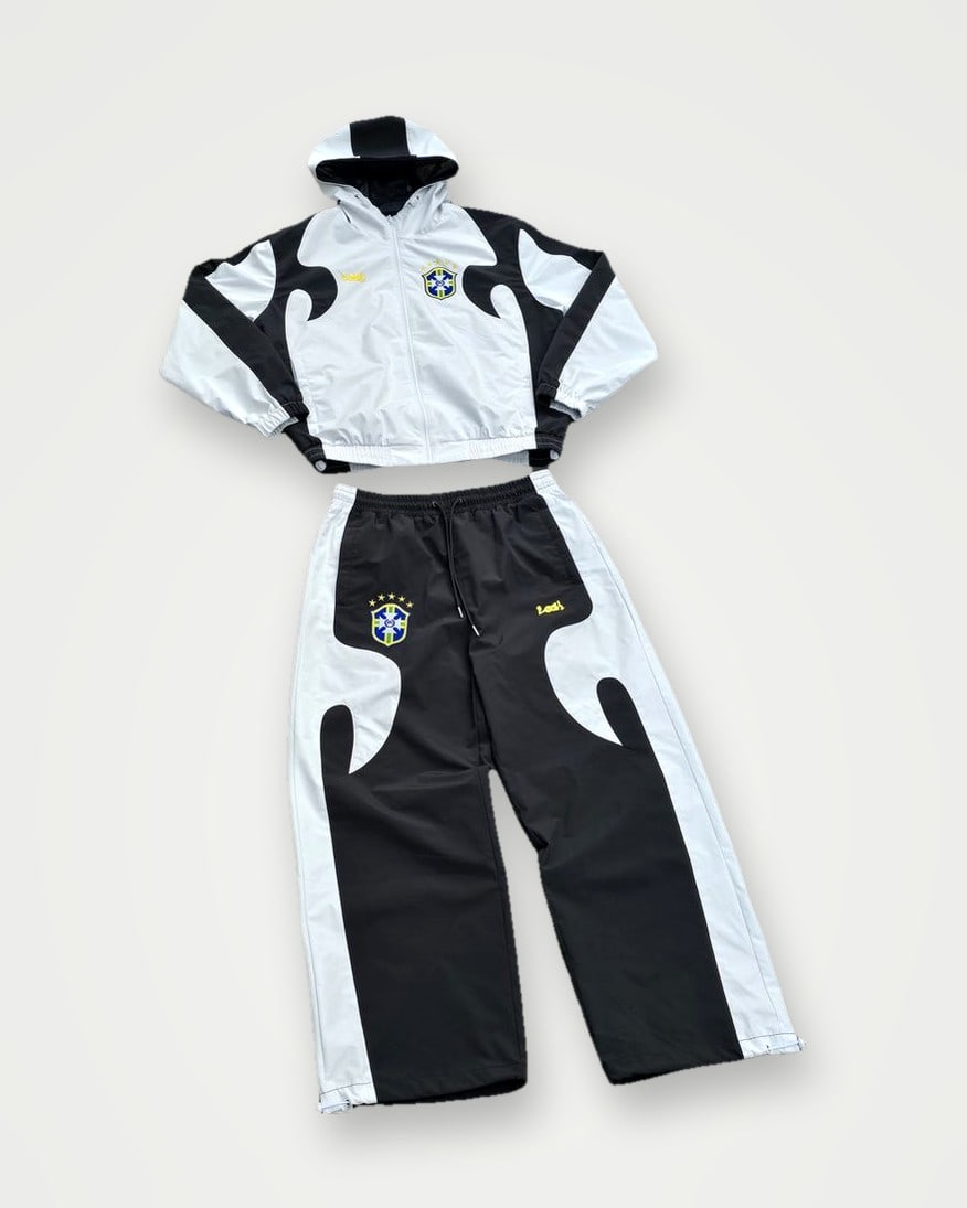 Cropped white and black nylon jacket with wave-panel trousers