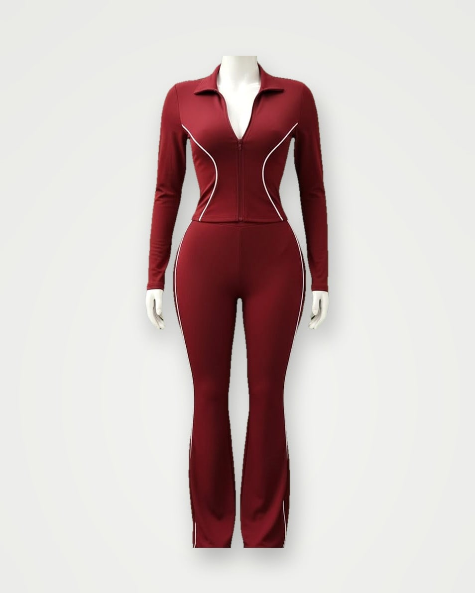 Side view of a burgundy training set with white piping