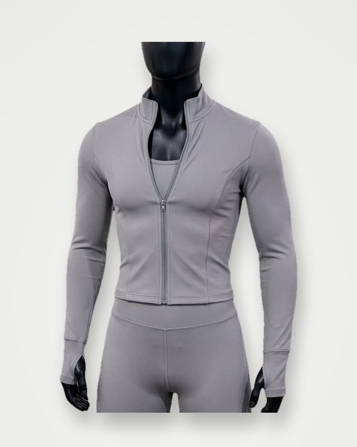 Grey zip-front training jacket and leggings set on a mannequin
