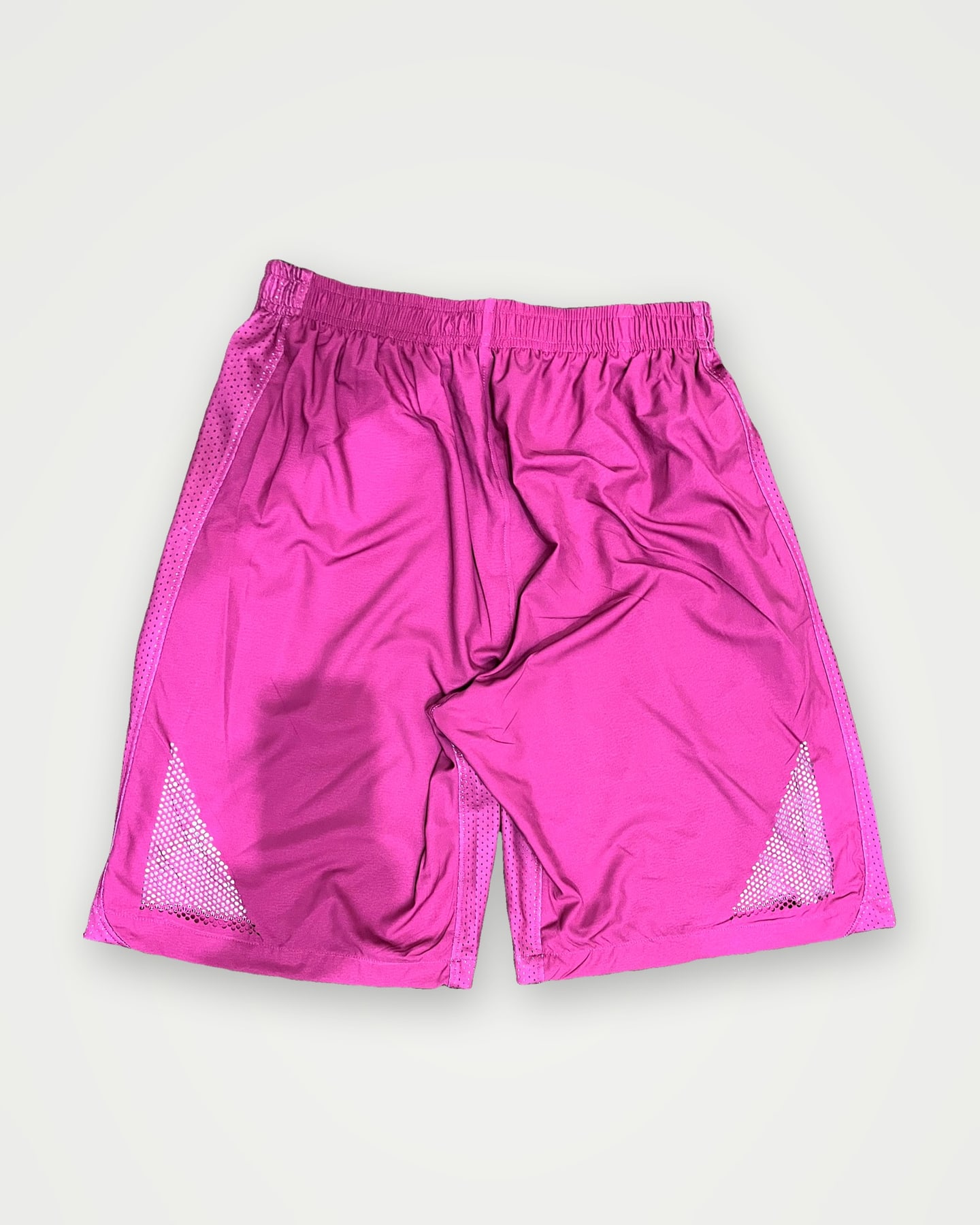 Pink training shorts with mesh side vents