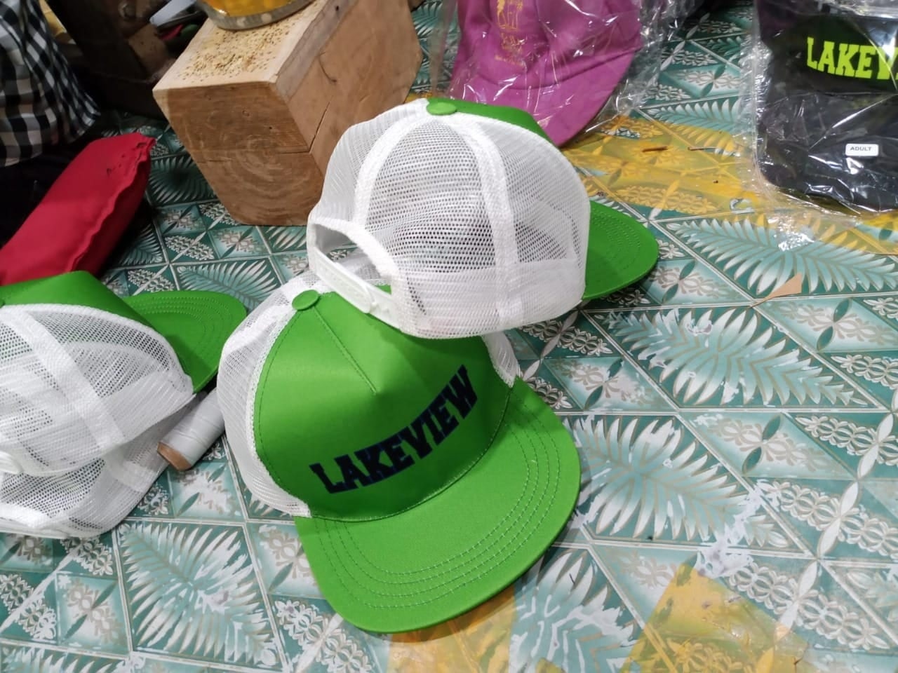 Green and white mesh trucker caps